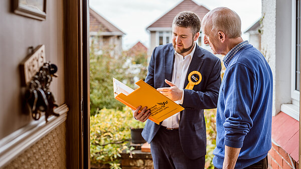 Candidate talking to member of the public