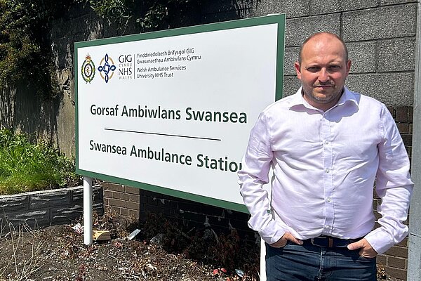Sam outside Cwmbwrla Ambulance Station.